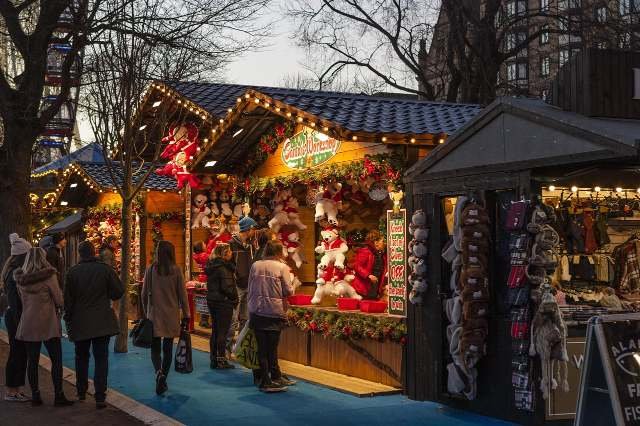 Students working at a festive Christmas market for seasonal jobs UK